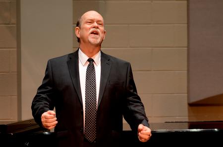 Michael Penny, professor of music, performs in a faculty voice recital in Hartley Recital Hall. - Photo by Meg Rushing
