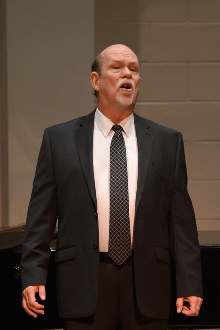 Michael Penny, professor of music, performs in a faculty voice recital in Hartley Recital Hall. - Photo by Meg Rushing