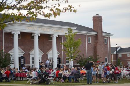 Students and their families come to support Chi Omega's BBQ fundraiser for the Make-A-Wish foundation at the Bowld Student Commons during Family Weekend.  - Photo by Emily Stookey