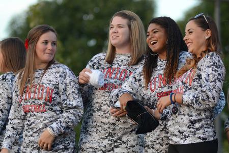 Softball players, Carter Mansolino, Kelly Robey, Alex Williams and Carlie Brickley are introduced along with the rest of their team at the Family Weekend Union Night festivities on the Great Lawn.  - Photo by Emily Stookey