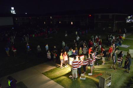 Students and their families enjoy Movie on the Lawn hosted by the Student Activities Council during Family Weekend. - Photo by MiKalla Cotton
