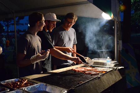 Members of Lambda Chi Alpha, Heath Ransom, Will Shackelford and Chris Mimms grill burgers for students and their families at Union Night during Family Weekend. - Photo by MiKalla Cotton