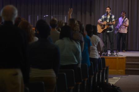 Brett Perkins, class of 2014, leads students in worship in chapel to kick off Family Weekend. - Photo by Amanda Rohde