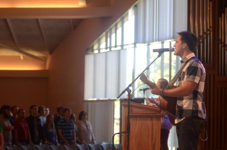 Brett Perkins, class of 2014, leads students in worship in chapel to kick off Family Weekend. - Photo by Amanda Rohde