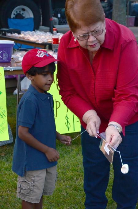Phyllis Davenport, coordinator of campus events and chapel facilitator, roasts a marshmallow at Union Night during Family Weekend. - Photo by Amanda Rohde