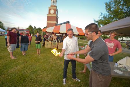 Dub Oliver, president of the university, participates in a chemistry demonstration during Union Night. Several student organizations set up booths with activities for Family Weekend guests during this event. - Photo by Morris Abernathy