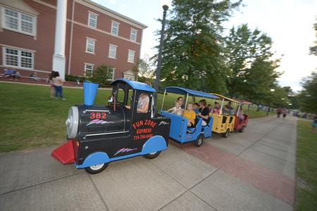 The kid's train travels around the great lawn with Family Weekend guests during Union Night.  - Photo by Morris Abernathy