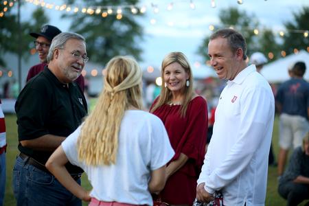 Dub and Susie Oliver, president and first lady of the university, chat with Caroline Priddy and her father during Union Night, a part of Family Weekend.  - Photo by Kristi McMurry Woody