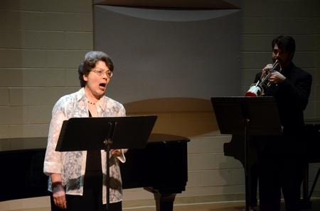 Georgia Welborn, professor of music, performs "I Taste a Liquor Never Brewed" by Barbara Harbach. - Photo by Amanda Rohde