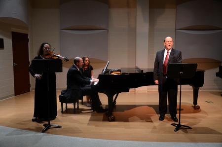 Michael Penny, professor of music, sings "Terezin Songs" by Barbara Harbach. - Photo by Amanda Rohde