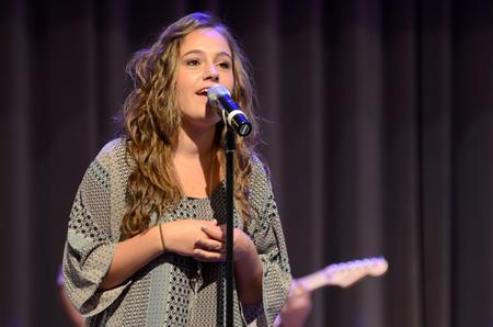 Hallie Shepard, senior music education major, sings with the Refuge band from Englewood Baptist Church in chapel during Faith in Practice Week in the G.M. Savage Memorial Chapel. - Photo by MiKalla Cotton