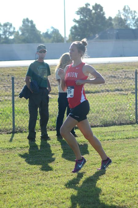 Sarah Fickley, freshman biology major, runs in a cross country meet on Union University's campus. - Photo by Meg Rushing