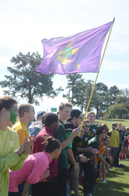 Lambda Chi Alpha members proudly display their flag during the events at Greek Olympics.  - Photo by Emily Stookey