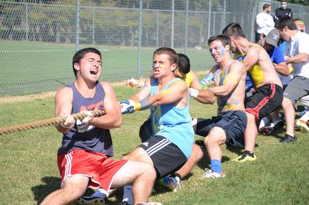 Members of Alpha Tau Omega compete against Lambda Chi Alpha in the rope pull for Greek Olympics.  - Photo by Emily Stookey