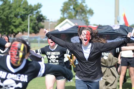 Chi Omega Haley Stafford, junior teaching and learning major, celebrates her sorority's win at Greek Olympics. - Photo by Emily Stookey
