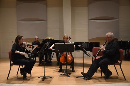 A quartet consisting of violinist Katie Ryan, pianist and professor of music Terry McRoberts, cellist Jamie Stephens, and clarinetist and professor of music David McClune perform in Hartley Recital Hall. - Photo by Meg Rushing