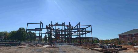 Each day more steel goes up on the Construction site.  Construction workers position the crane to hang more steel beams.  Some of the beams weigh as much as 10,000 pounds and are 30 feet long.  The look of the great lawn will change forever. - Photo by Morris Abernathy