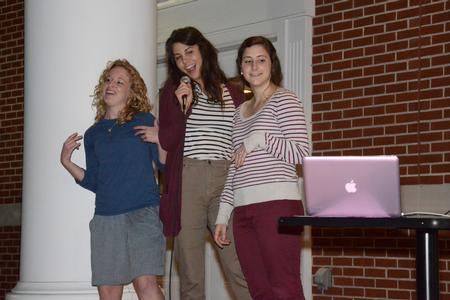Bethany Kindt, senior art major, Lizi Frazier, junior TESL major, and Gena Nesticó, sophomore, sing karaoke at Kampfire Karaoke put on by junior council on the front porch of the Bowld Student Commons. - Photo by MiKalla Cotton