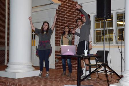 Katie Tansey, Clare Williams, Gray Magee, and Willie Louth enjoy singing at Kampfire Karaoke put on by junior council on the porch of the Bowld Student Commons. - Photo by MiKalla Cotton