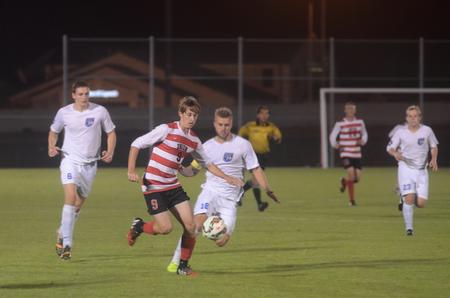 Seth Guiler, junior engineering major, blocks the ball from Shorter University. - Photo by Amanda Rohde