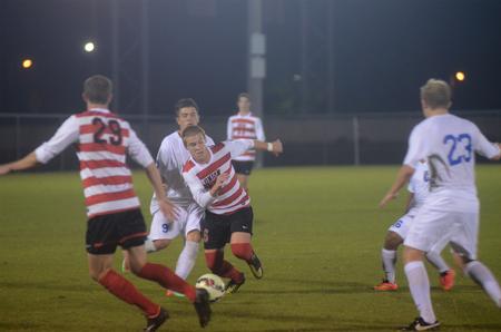 Kyle Yeoman, freshman administration major, avoids opponents from Shorter University. - Photo by Amanda Rohde