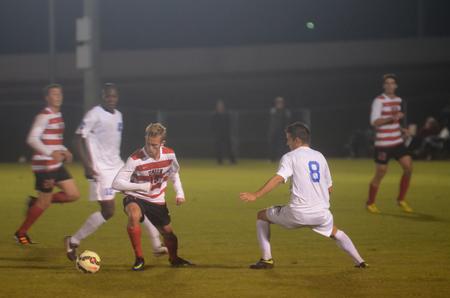 Alex Pratt, senior business administration major, steals the ball from his Shorter University opponent. - Photo by Amanda Rohde