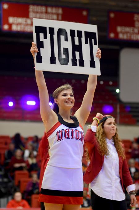 Cheerleader Moriah Dreisbach, freshman nursing major, leads students in chants at Bulldog Madness. - Photo by Meg Rushing