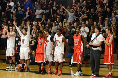 The men's basketball team cheers on the faculty in the student/faculty scrimmage at Bulldog Madness. - Photo by Stephanie Schroeder