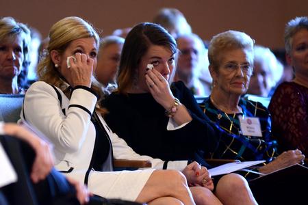 Susie and Callie Oliver, wife and daughter of Dub Oliver, react to Dub Oliver's inaugural remarks, which included thanks to his family for their incredible love and support. - Photo by Emily Stookey