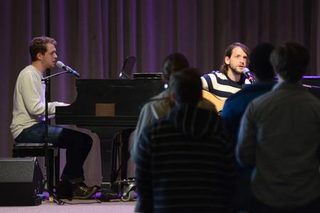Thomas Griffith, junior art major, and Rob Griffith, senior english major, play music during chapel in the G.M. Savage Memorial Chapel. - Photo by MiKalla Cotton