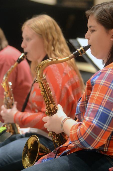 Giggi DeCoursey, sophomore music education major, plays the tenor saxophone at the Jazz Band Concert. - Photo by Amanda Rohde