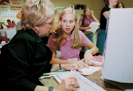 Sherry Tignor (left), co-director of the Center for New Students, assists Jill Martin, freshman from Lebanon, Tenn., with registration options during Freshman Pre-Registration. - Photo by Jim Veneman