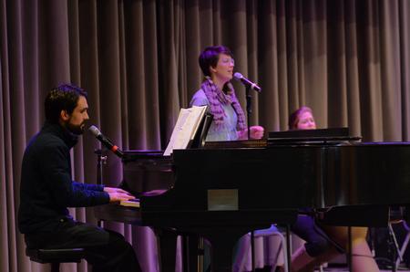 Cody Curtis, assistant resident director for the male quads, and the university band lead worship for the Preview Day chapel service. - Photo by Emily Stookey