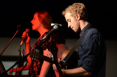 Kelsie Leaf, junior public relations major, and Zach Lancaster, junior art major, sing in Barefoots Joe for the English Department's A Christmas Carol cookie exchange. - Photo by MiKalla Cotton