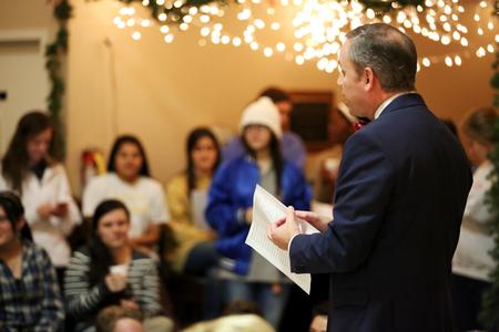 Dub Oliver, president of the university, begins Christmas with the Olivers with a few Christmas carols. - Photo by Kristi McMurry Woody