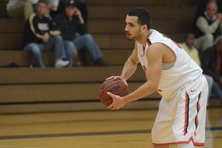 Pedro Faller, senior business administration, prepares to pass in a game against Lee University. - Photo by MiKalla Cotton