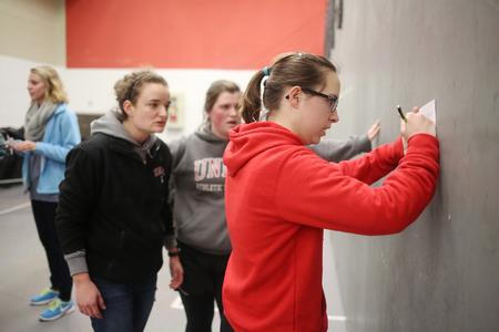 Bridgette Wilson, sophomore biology major, answers questions on a quiz as part of the 4th challenge in res-life's Amazing Race event. - Photo by Kristi McMurry Woody