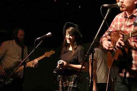 Casey Harper, vocalist for Family and Friends, plays a show with the Georgia-based group in Barefoots Joe. - Photo by Kristi McMurry Woody