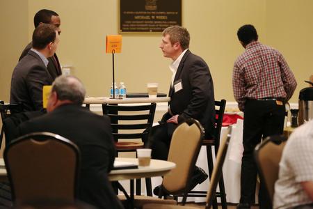 Brad Rogers, MBA student, speaks with the professionals at the College to Career event hosted by the Vocatio Center.  - Photo by Kristi McMurry Woody