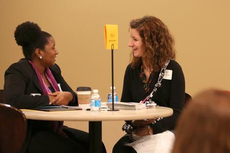 Blair Baugher, senior nursing major, chats with one of several professionals at the College to Career fair hosted by the Vocatio Center for Life Calling and Career. - Photo by Kristi McMurry Woody