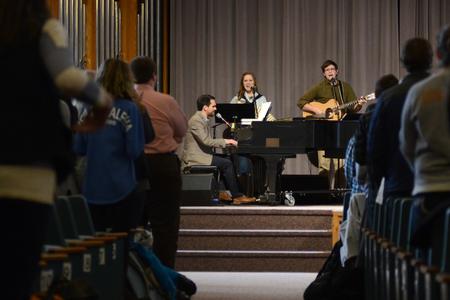 Christopher Curtis, assistant resident director for the men's quads, and the band lead students in worship during Scholars of Excellence weekend in the G.M. Savage Memorial Chapel. - Photo by MiKalla Cotton