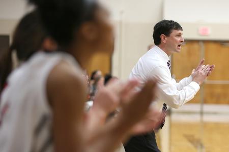 Mark Campbell, head coach, cheers for his team as they make a good play against Valdosta State University. - Photo by Kristi McMurry Woody