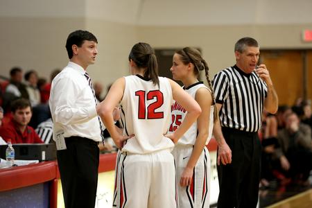 Mark Campbell, head women's basketball coach, instructs his players during a foul shot in a game against Valdosta State University. - Photo by Kristi McMurry Woody