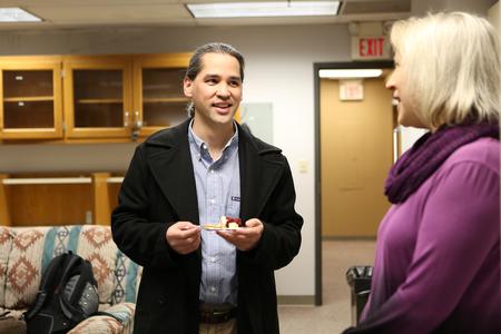 Fonsie Guilaran, associate professor of physics, chats with Jeannette Russ, professor of engineering and department chair, during a reception celebrating National Engineering Week.  - Photo by Kristi McMurry Woody