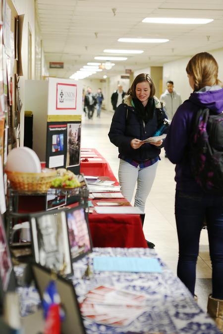Students pick up info flyers at the External Study Fair in the PAC hallway. - Photo by Kristi McMurry Woody