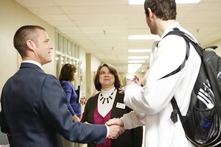 Phillip Ryan, coordinator of the ESL program, and Victoria Malone, coordinator of study abroad, chat with a student at the External Study Fair, which gives students an opportunity to learn about study abroad opportunities.  - Photo by Kristi McMurry Woody