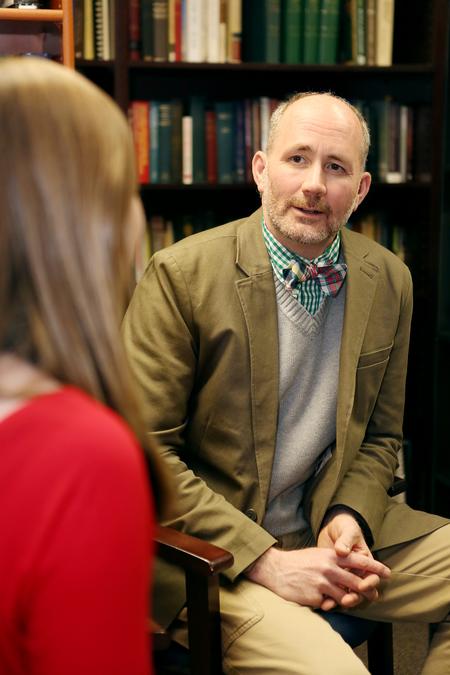 Brad Green, associate professor of Christian thought and tradition, meets with a student in his office.  - Photo by Kristi McMurry Woody