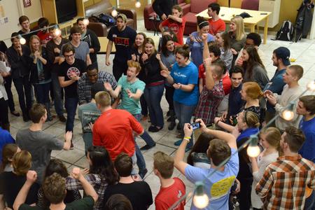 Students cheer as the winners are revealed after the tie breaker game during the Minute to Win it event hosted by Residence Life in the McAfee Commons. - Photo by MiKalla Cotton