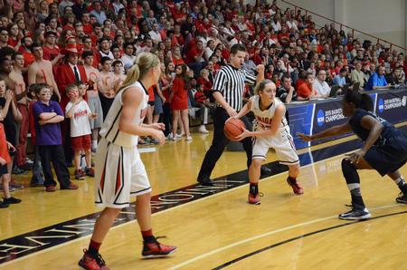 Amy Philamlee prepares to pass while the crowd cheers during the NCAA Division II Women's Basketball South Region Championship Game. - Photo by MiKalla Cotton