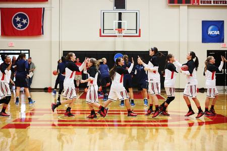 The Lady Bulldog basketball team runs onto the court to warm up before the championship game of the NCAA Division II South Region Tournament against Nova Southeastern. - Photo by Kristi McMurry Woody